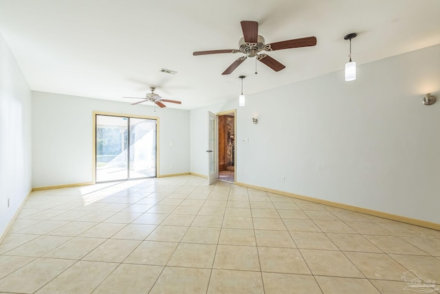 tiled empty room with ceiling fan