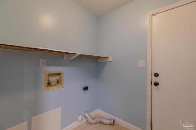 washroom with hookup for a washing machine, hookup for an electric dryer, and a textured ceiling