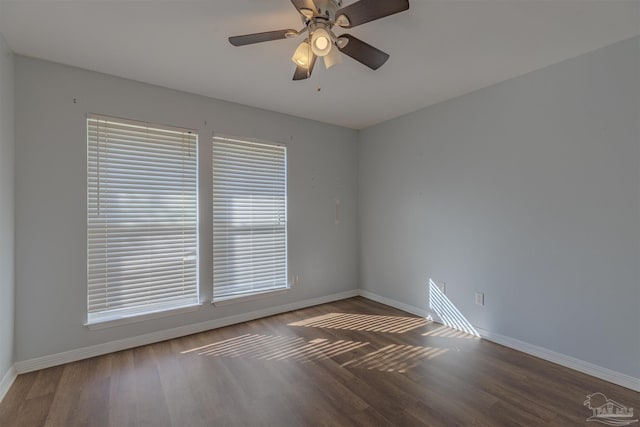 spare room featuring hardwood / wood-style floors and ceiling fan