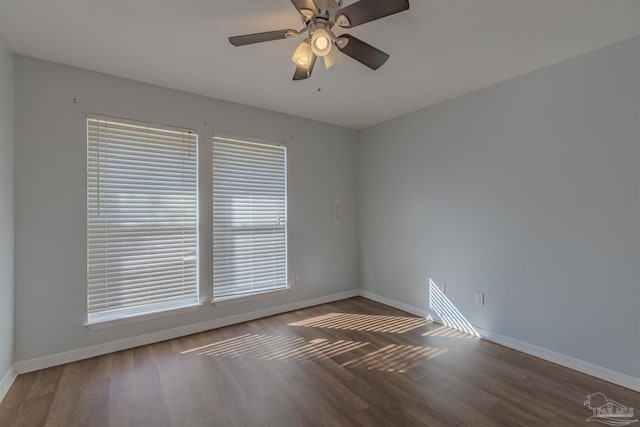 empty room with ceiling fan and wood-type flooring