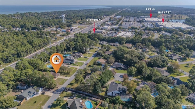 birds eye view of property with a water view