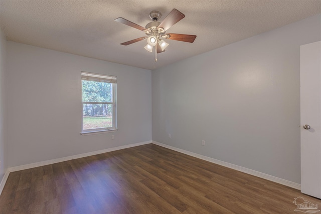 unfurnished room featuring ceiling fan, dark wood-type flooring, and a textured ceiling