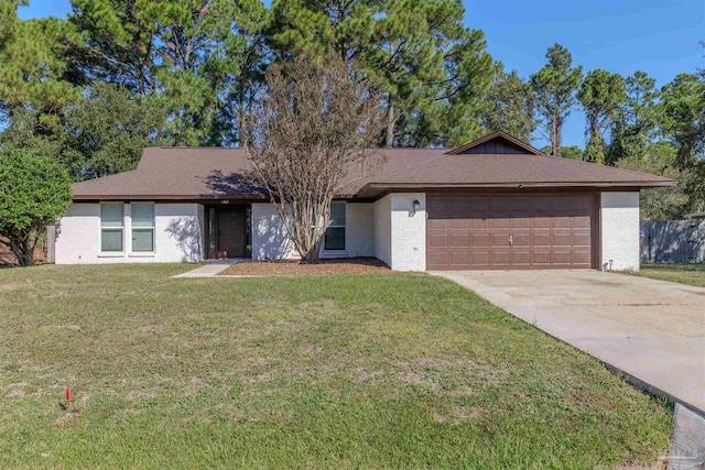 ranch-style house with a garage and a front lawn