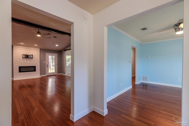 hall with crown molding, vaulted ceiling with beams, a textured ceiling, and dark hardwood / wood-style floors