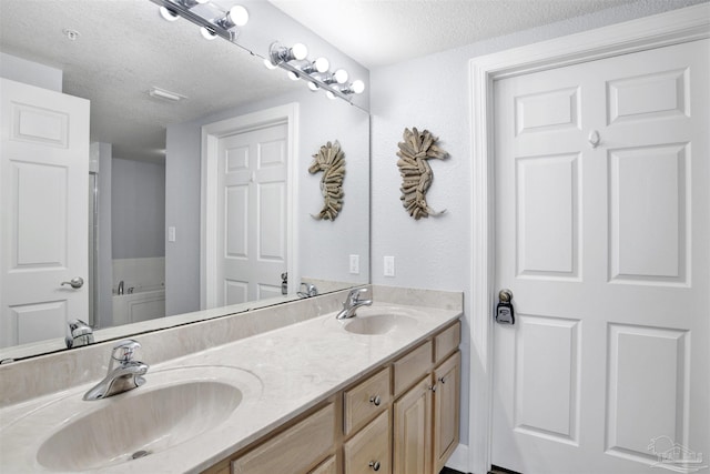154 Ethel Wingate Dr Unit 109, Pensacola, FL 32507 - bathroom with vanity and a textured ceiling