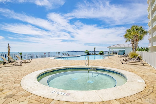154 Ethel Wingate Dr Unit 109, Pensacola, FL 32507 - view of swimming pool featuring a hot tub, a patio, and a water view