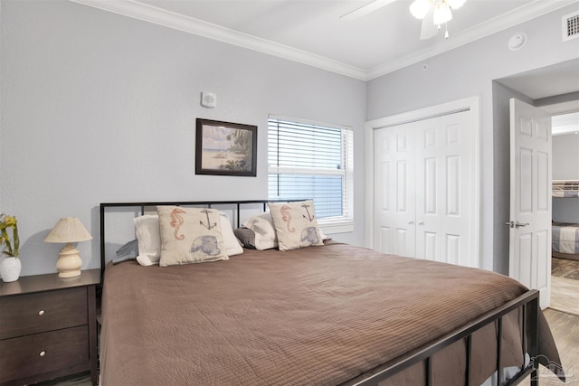 154 Ethel Wingate Dr Unit 109, Pensacola, FL 32507 - bedroom with ceiling fan, ornamental molding, wood-type flooring, and a closet