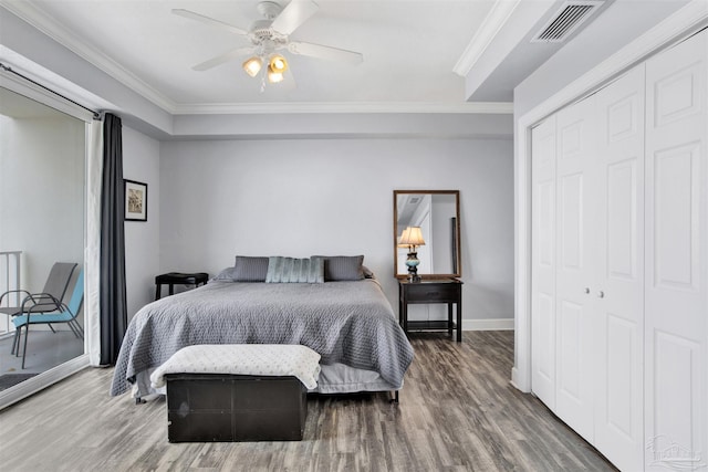 154 Ethel Wingate Dr Unit 109, Pensacola, FL 32507 - bedroom with dark hardwood / wood-style floors, a closet, ceiling fan, and ornamental molding