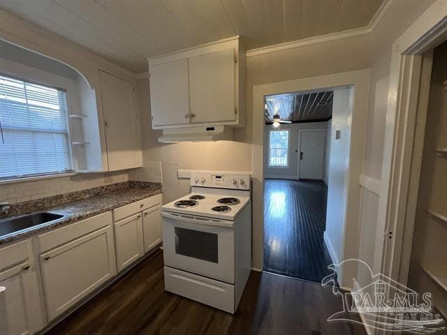 kitchen with dark wood-type flooring, white electric range, under cabinet range hood, white cabinetry, and a sink