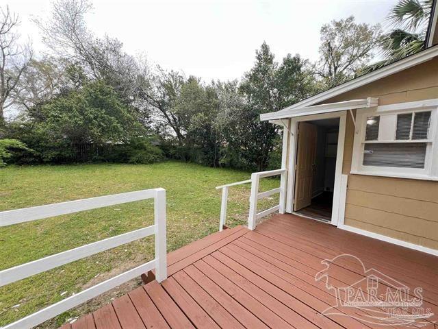 wooden deck with a yard