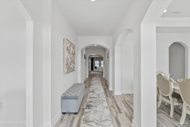 corridor featuring light hardwood / wood-style floors