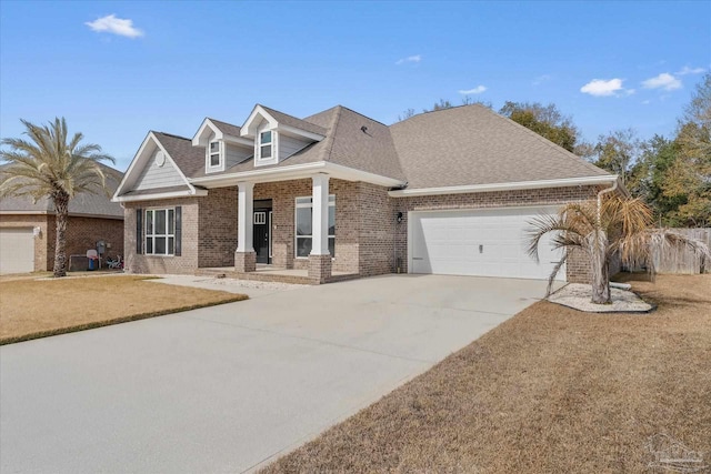 view of front of house featuring a garage and a front yard