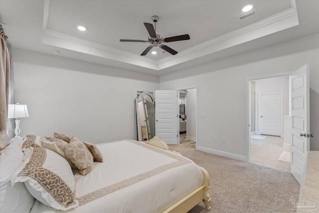 bedroom featuring a raised ceiling, ornamental molding, light carpet, and ceiling fan