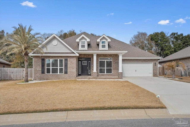 view of front of house featuring a garage and a front yard