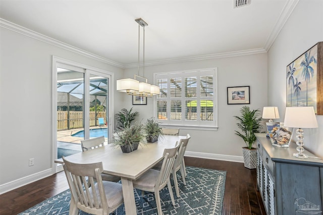 dining room with crown molding, baseboards, dark wood-style flooring, and visible vents