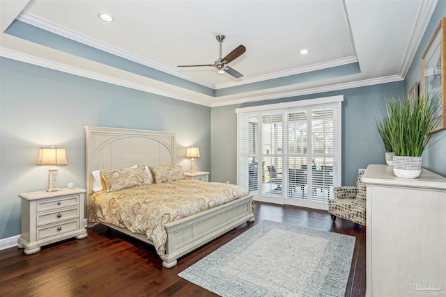bedroom with a ceiling fan, crown molding, a raised ceiling, dark wood-style floors, and access to outside