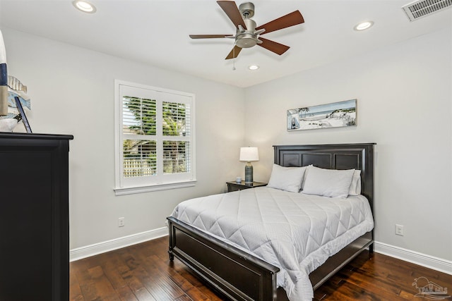 bedroom featuring wood-type flooring, baseboards, and visible vents