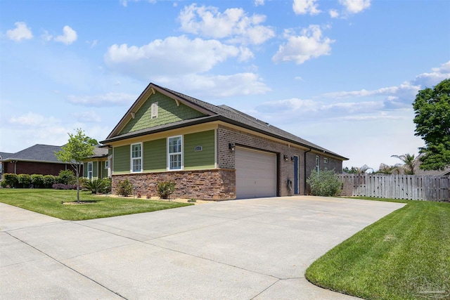 view of front of house with a garage, fence, a front yard, brick siding, and driveway