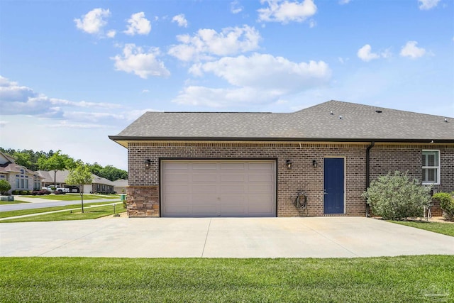 single story home with roof with shingles, brick siding, a garage, a front yard, and concrete driveway