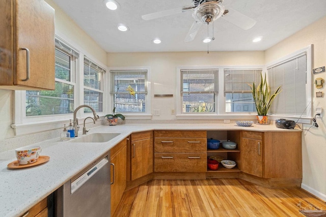 kitchen with dishwasher, ceiling fan, light wood-type flooring, and sink