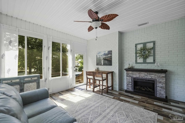 sunroom with a wealth of natural light and visible vents