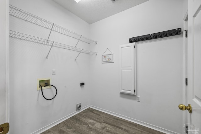 laundry area with hookup for an electric dryer, laundry area, hookup for a washing machine, baseboards, and dark wood finished floors
