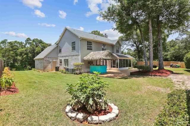 2724 Ashbury Ln, Cantonment, FL 32504 - rear view of property featuring a sunroom and a chimney
