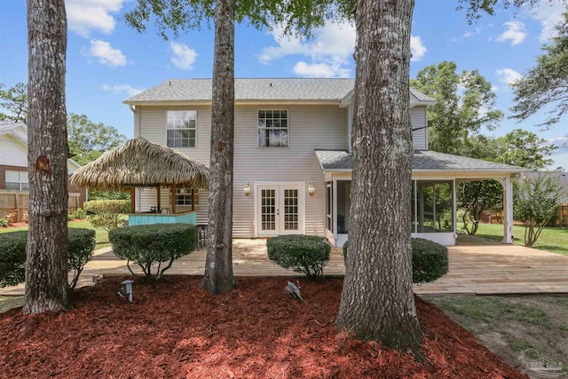2724 Ashbury Ln, Cantonment, FL 32504 - view of front of property featuring french doors, a patio, roof with shingles, and a sunroom