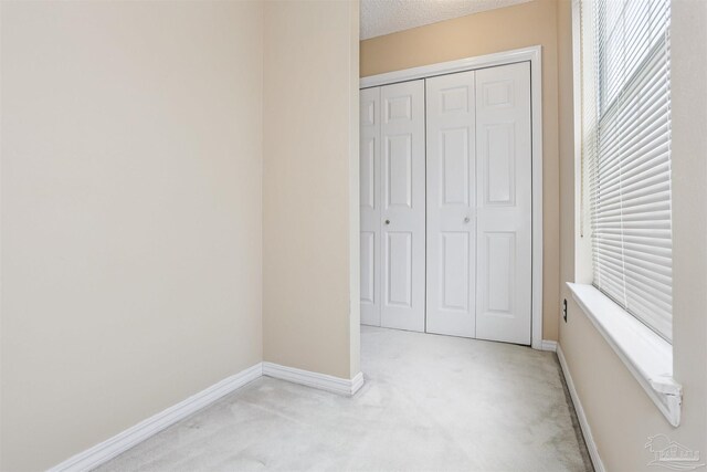 2724 Ashbury Ln, Cantonment, FL 32504 - unfurnished bedroom featuring light carpet and a closet