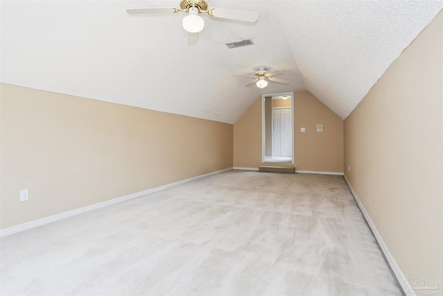 2724 Ashbury Ln, Cantonment, FL 32504 - bonus room with a ceiling fan, lofted ceiling, light colored carpet, and a textured ceiling