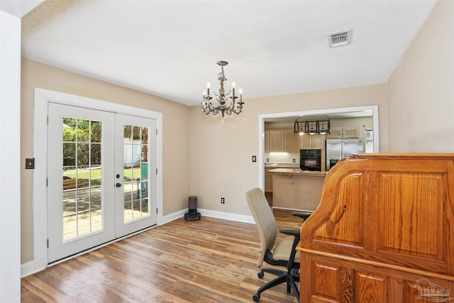 2724 Ashbury Ln, Cantonment, FL 32504 - office space with french doors, wood finished floors, and a chandelier