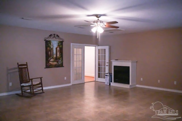 unfurnished living room featuring ceiling fan