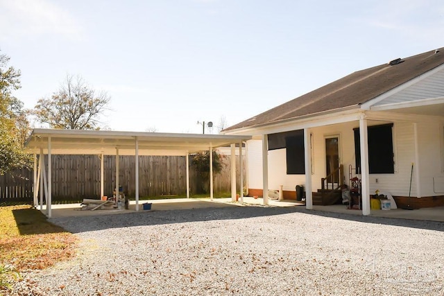 rear view of house with a carport