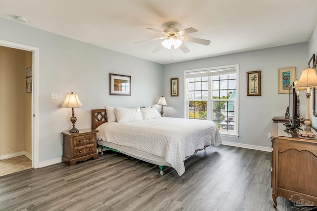 bedroom featuring dark hardwood / wood-style flooring and ceiling fan