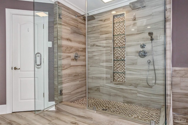 bathroom featuring a shower with shower door