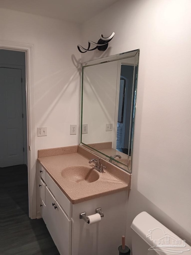 bathroom with vanity and toilet