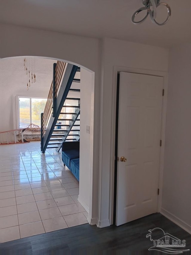 hall featuring tile patterned flooring