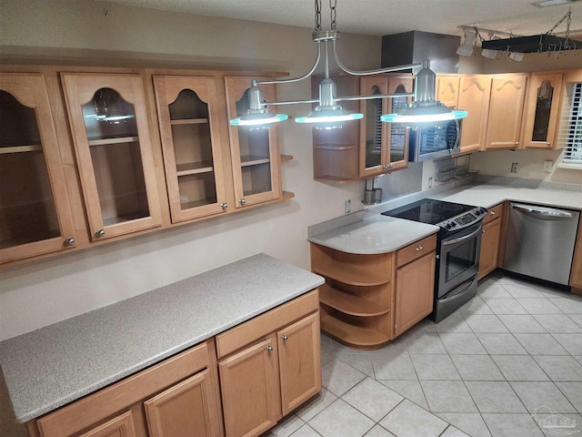 kitchen featuring black electric range, stainless steel dishwasher, decorative light fixtures, and light tile patterned floors