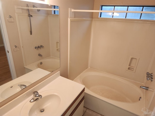 bathroom featuring tile patterned floors, vanity, and bathing tub / shower combination