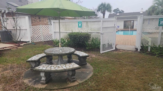 view of yard with a fenced in pool