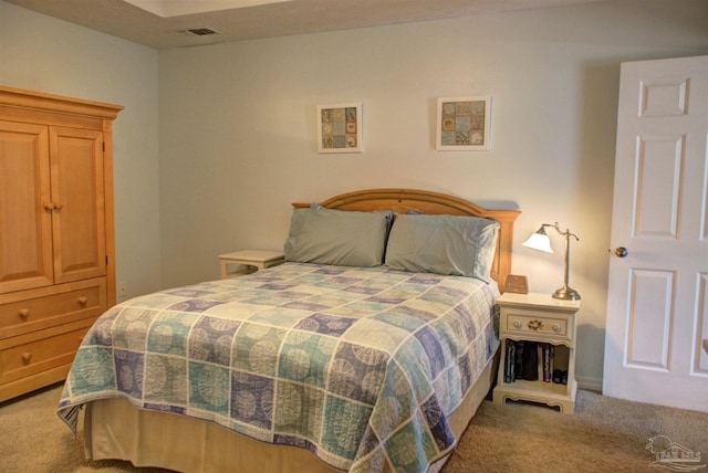 bedroom with light colored carpet