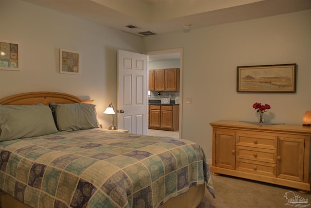 bedroom featuring light colored carpet