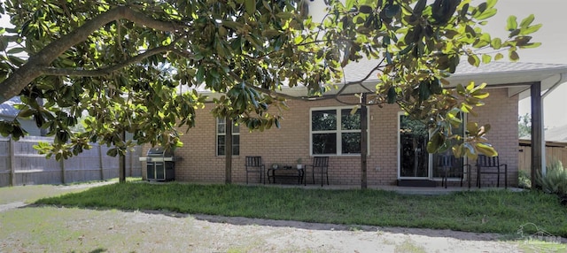 view of side of home featuring a yard