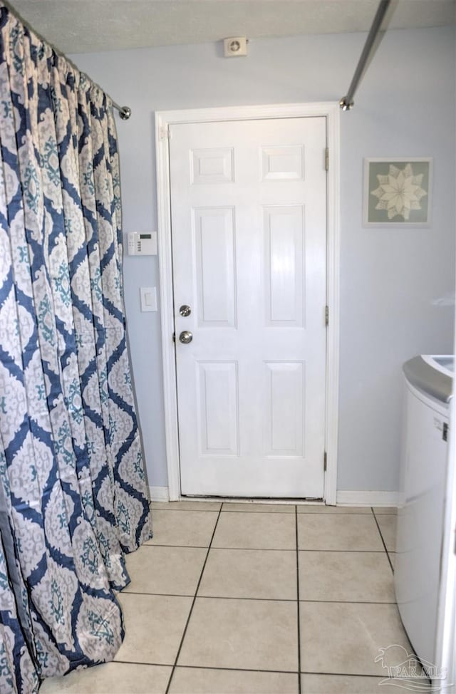 interior space with light tile patterned floors