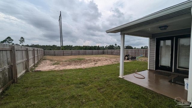 view of yard with a fenced backyard and a patio