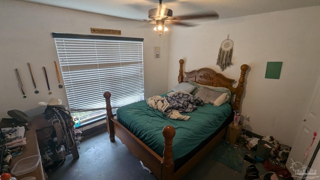 bedroom featuring finished concrete floors and a ceiling fan