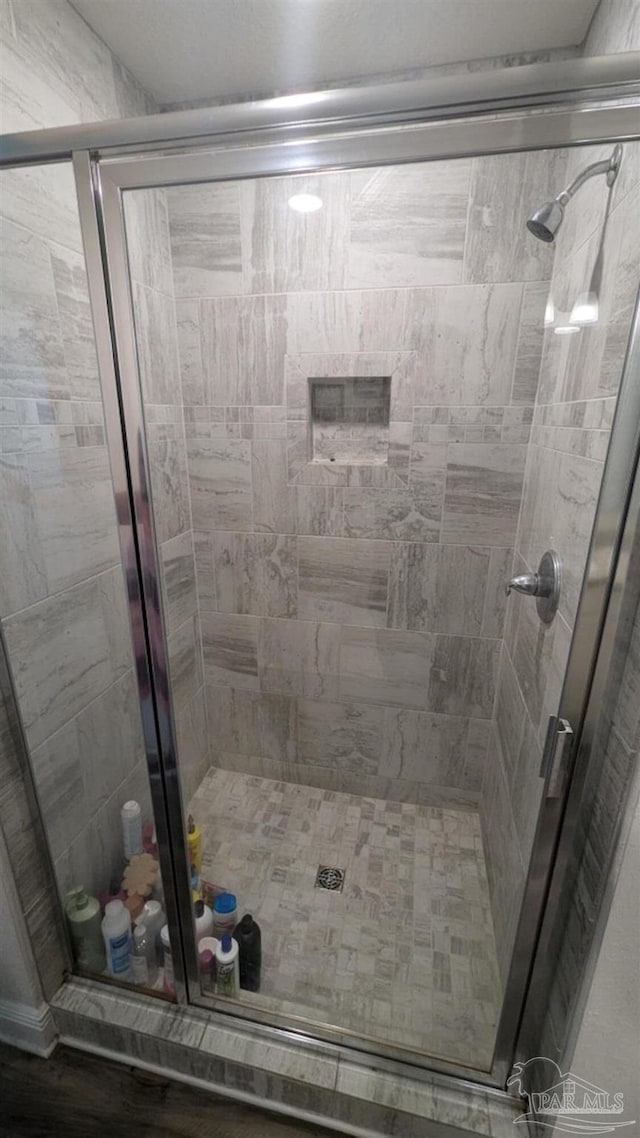 bathroom featuring a shower stall