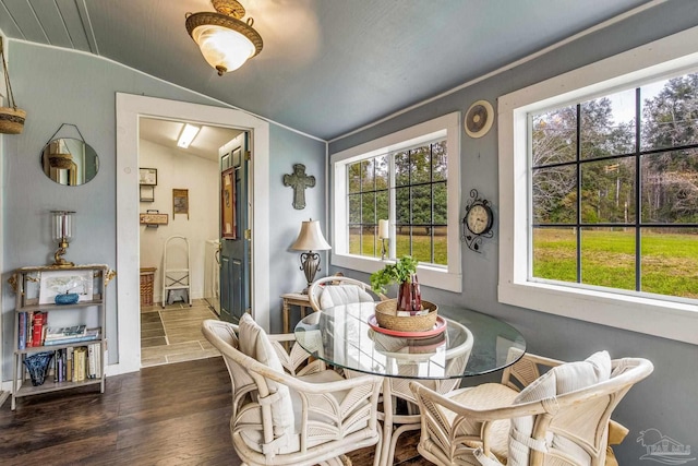 110 Glover Rd, Century, FL 32535 - dining area with lofted ceiling, wood finished floors, and healthy amount of natural light