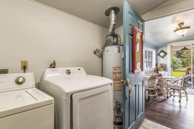 washroom featuring dark hardwood / wood-style floors, washing machine and dryer, and gas water heater