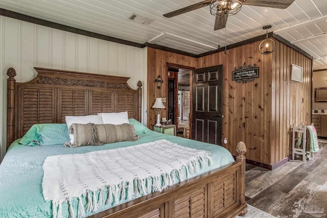 bedroom featuring dark hardwood / wood-style floors, ceiling fan, wooden ceiling, and wooden walls